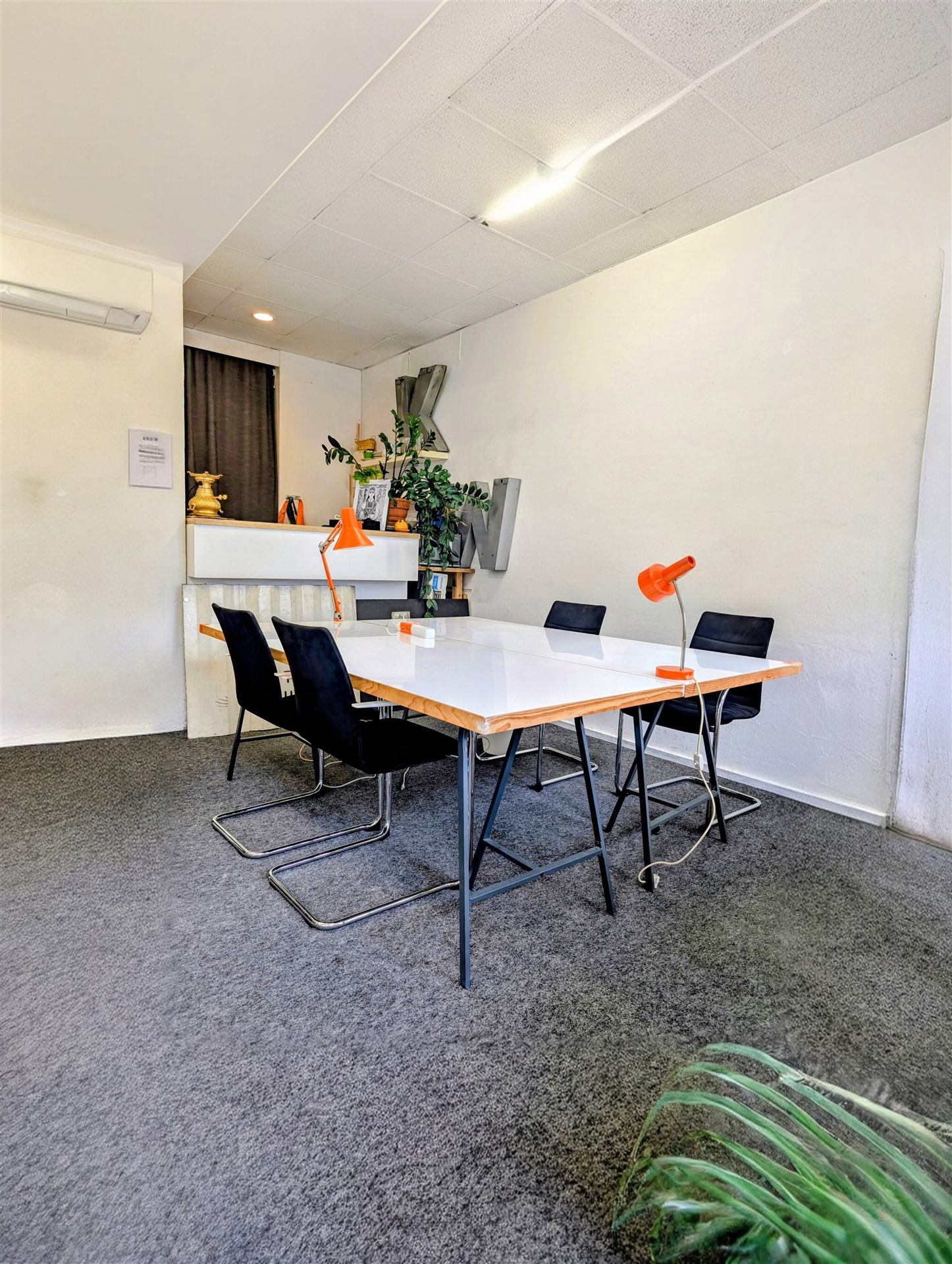 Desks near the shared kitchen area